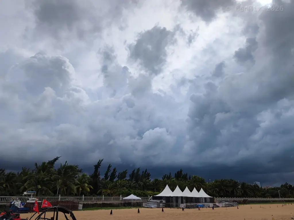 Haikou shoreline under storm clouds
